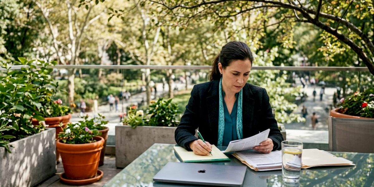 Lawyer reviewing earned media article at desk