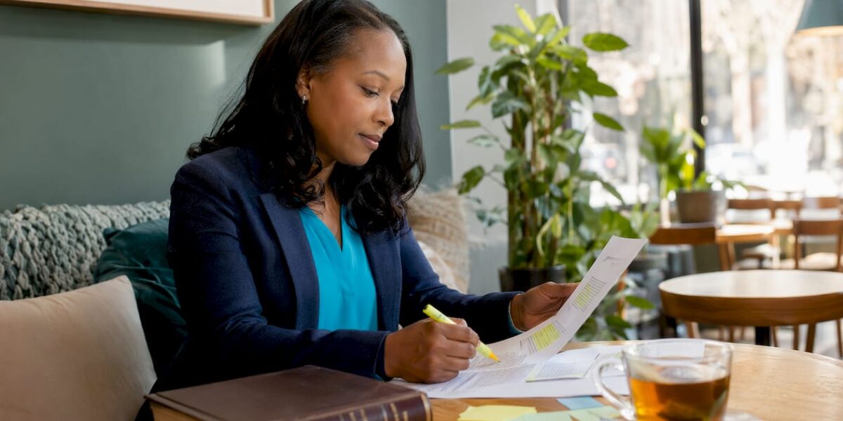 Attorney reviewing printed digital PR materials