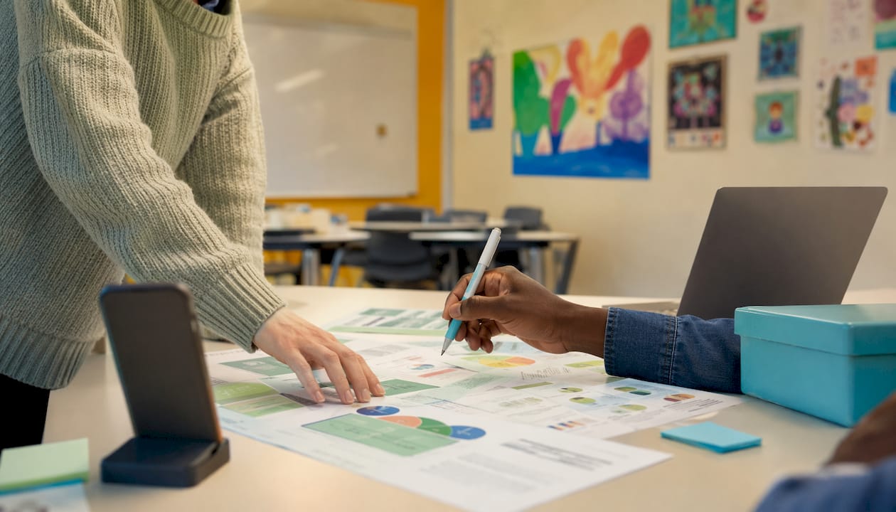 Close-up of hands sorting mental health PR documents