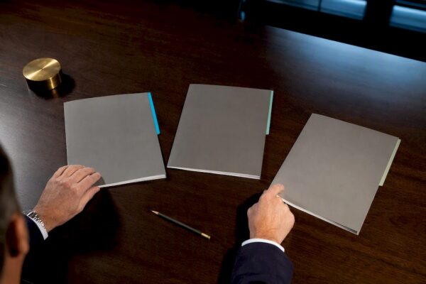 Judge reviewing organized legal award submissions