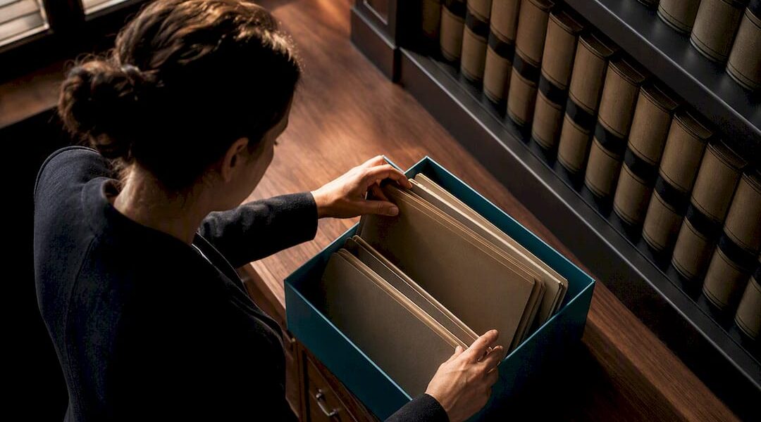 Researcher organizing legal record folders